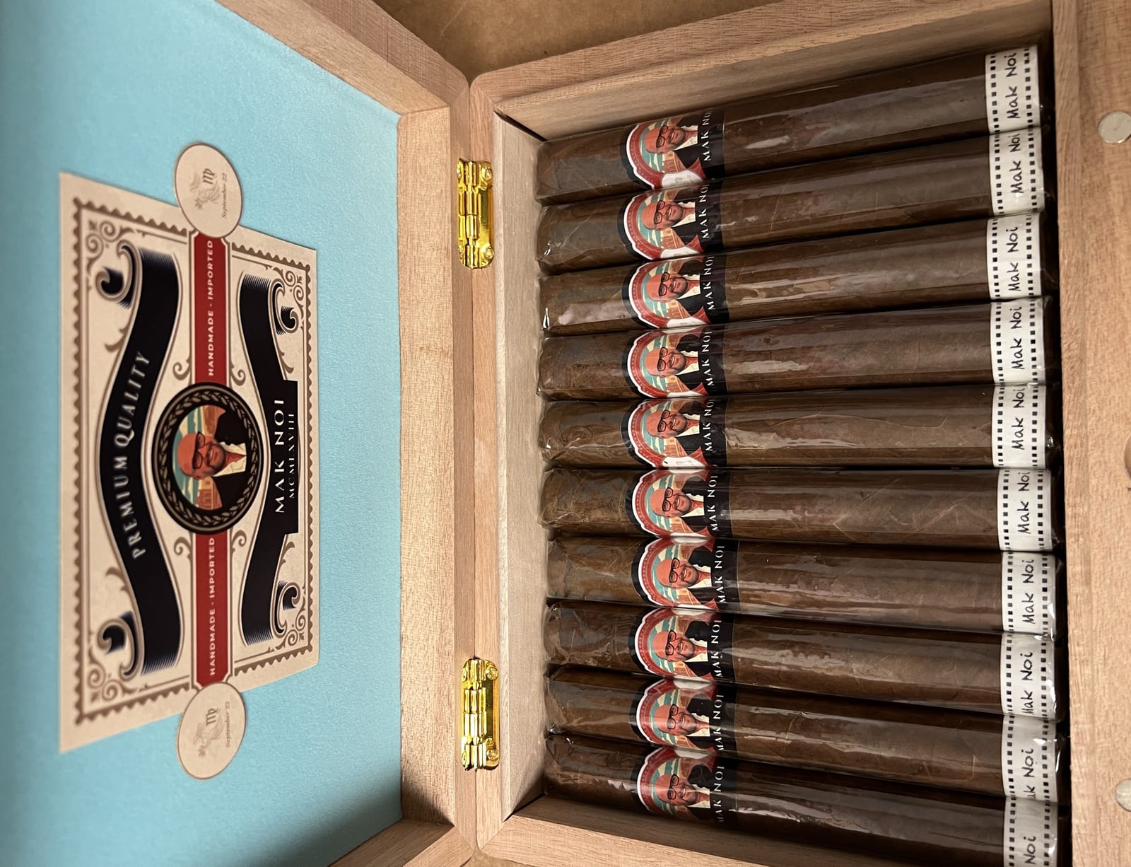 Full presentation box of groomsmen cigars, each with an individually named band